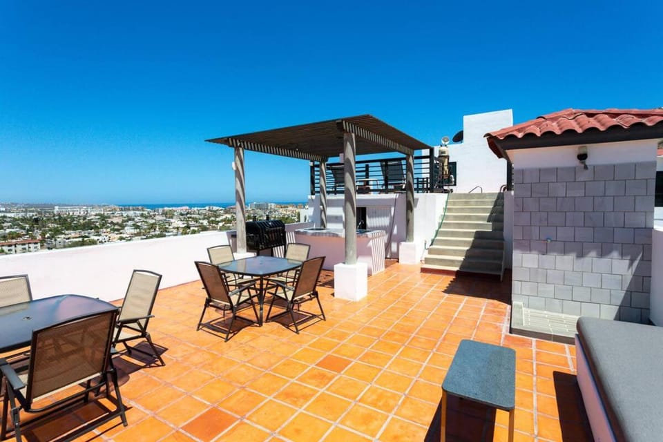 Property building, Patio, Day, BBQ facilities, Dining area, City view, Sea view, Swimming pool