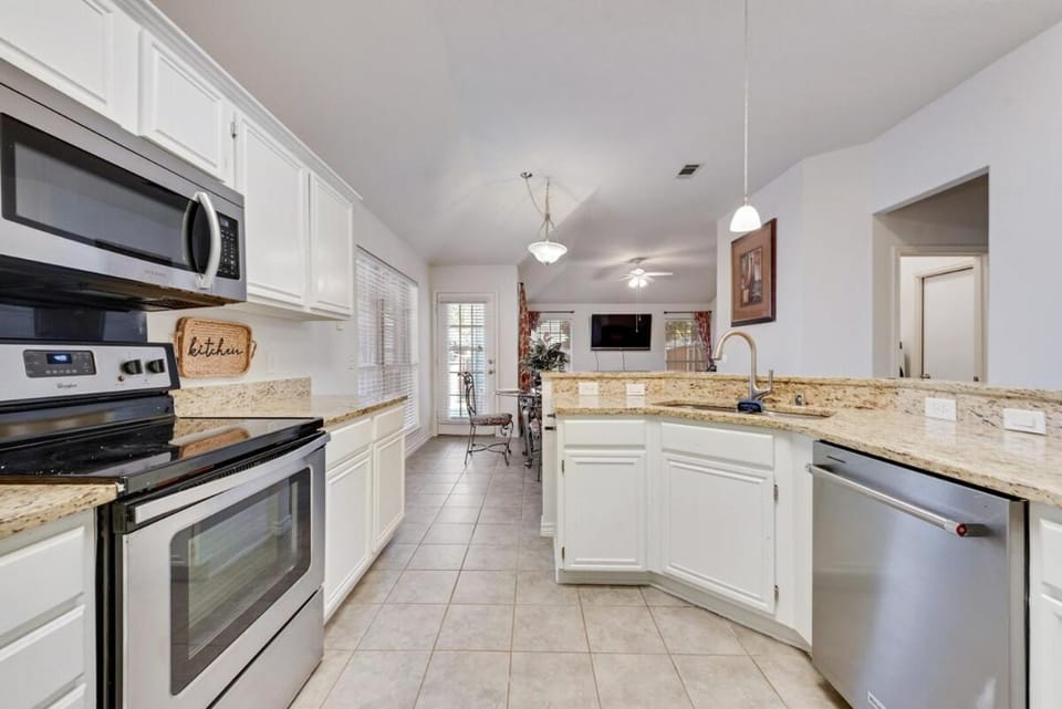 Kitchen or kitchenette, dishwasher, oven, stove, toaster