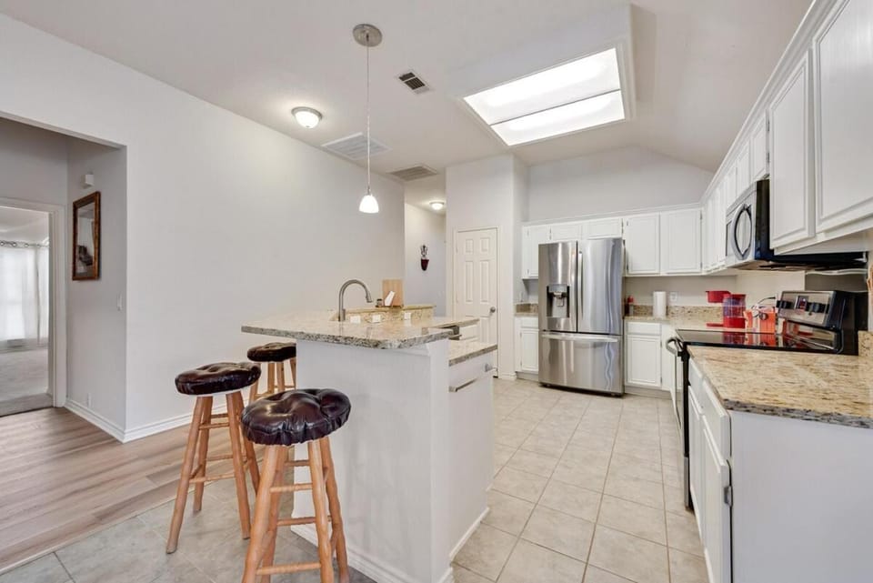 Kitchen or kitchenette, dishwasher, oven, stove, toaster