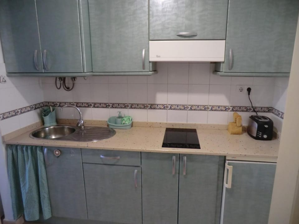 Kitchen or kitchenette, stove