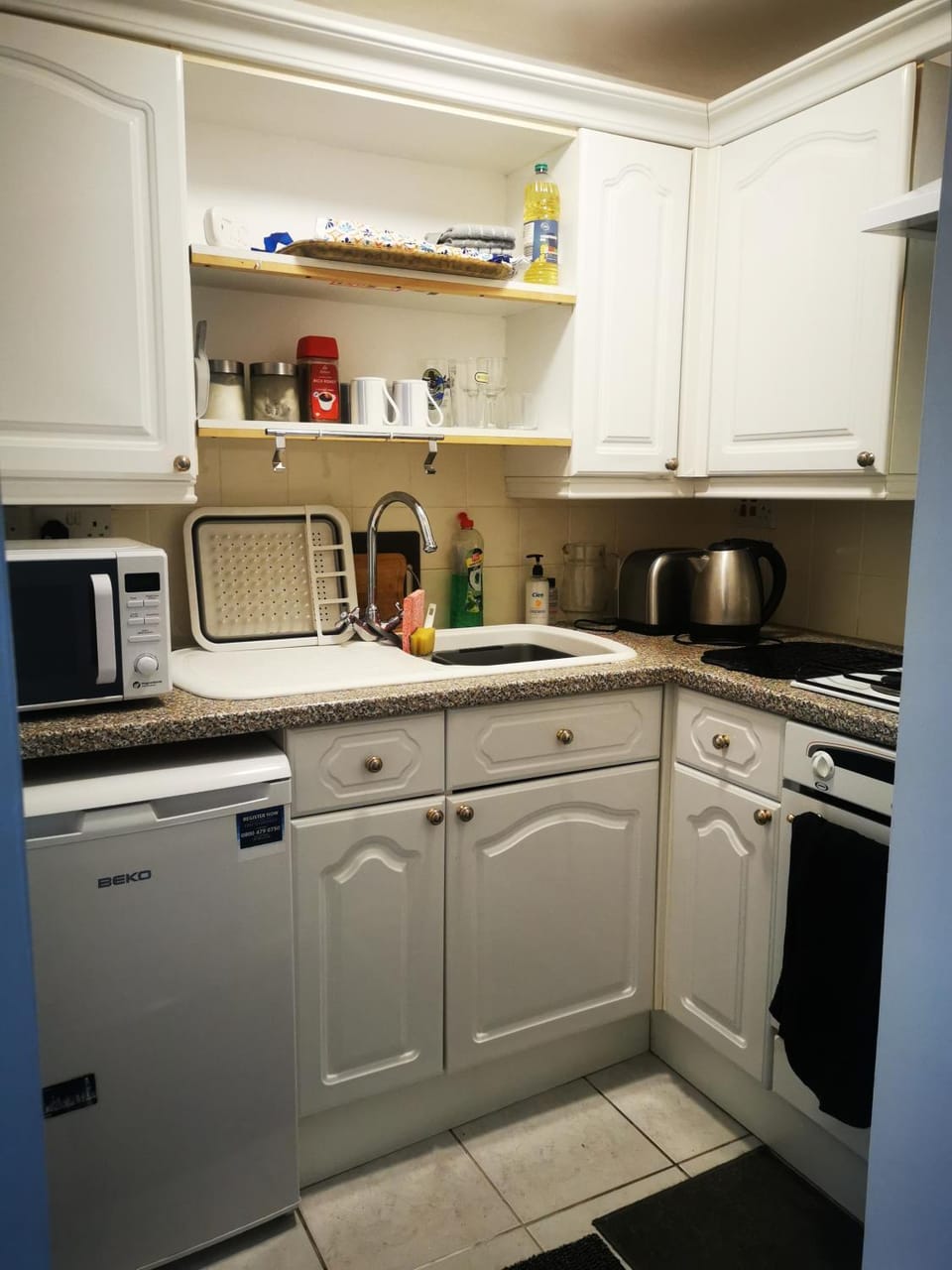 Kitchen or kitchenette, oven, stove, toaster