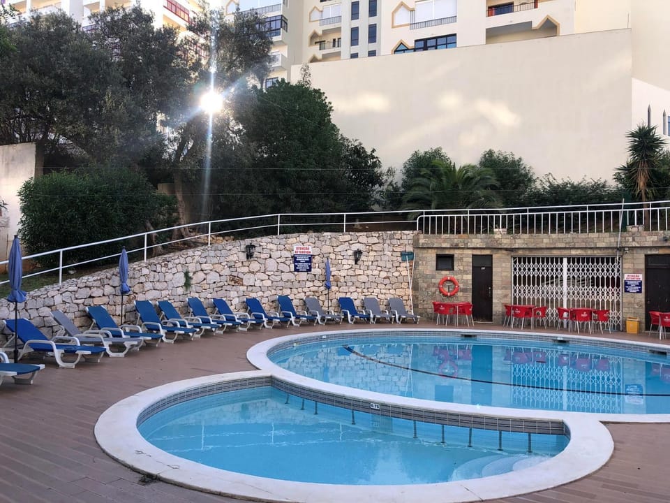 Property building, Living room, Swimming pool