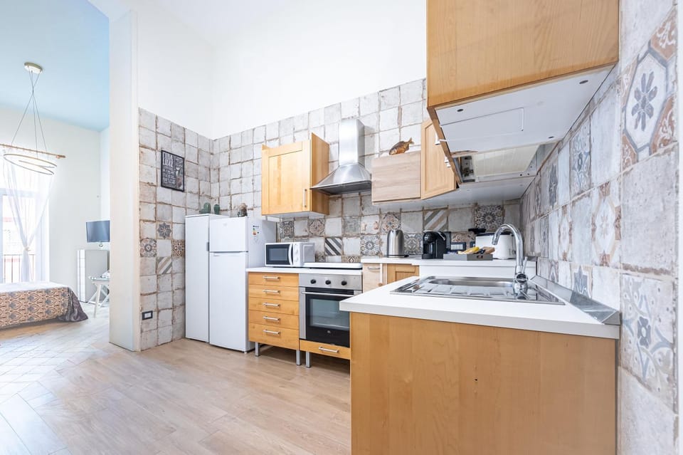Kitchen or kitchenette, microwave, oven, stove