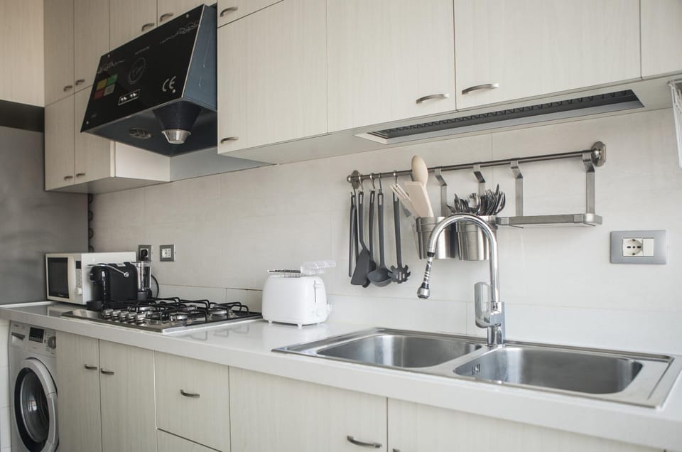 Kitchen or kitchenette, stove, toaster, washing machine