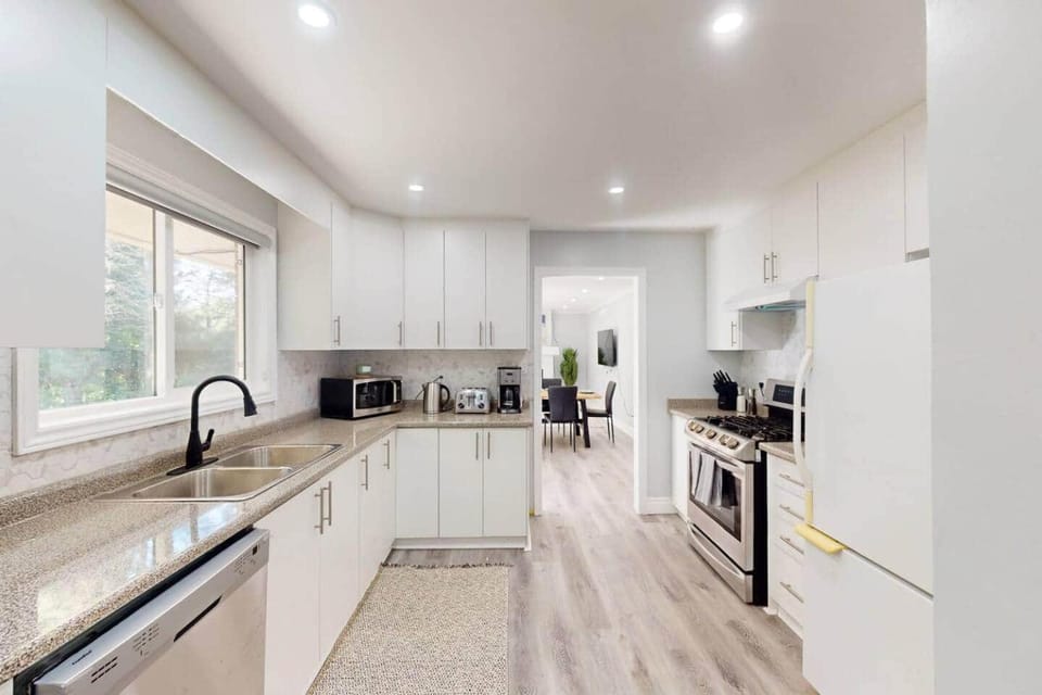 Kitchen or kitchenette, dishwasher, oven, stove, toaster