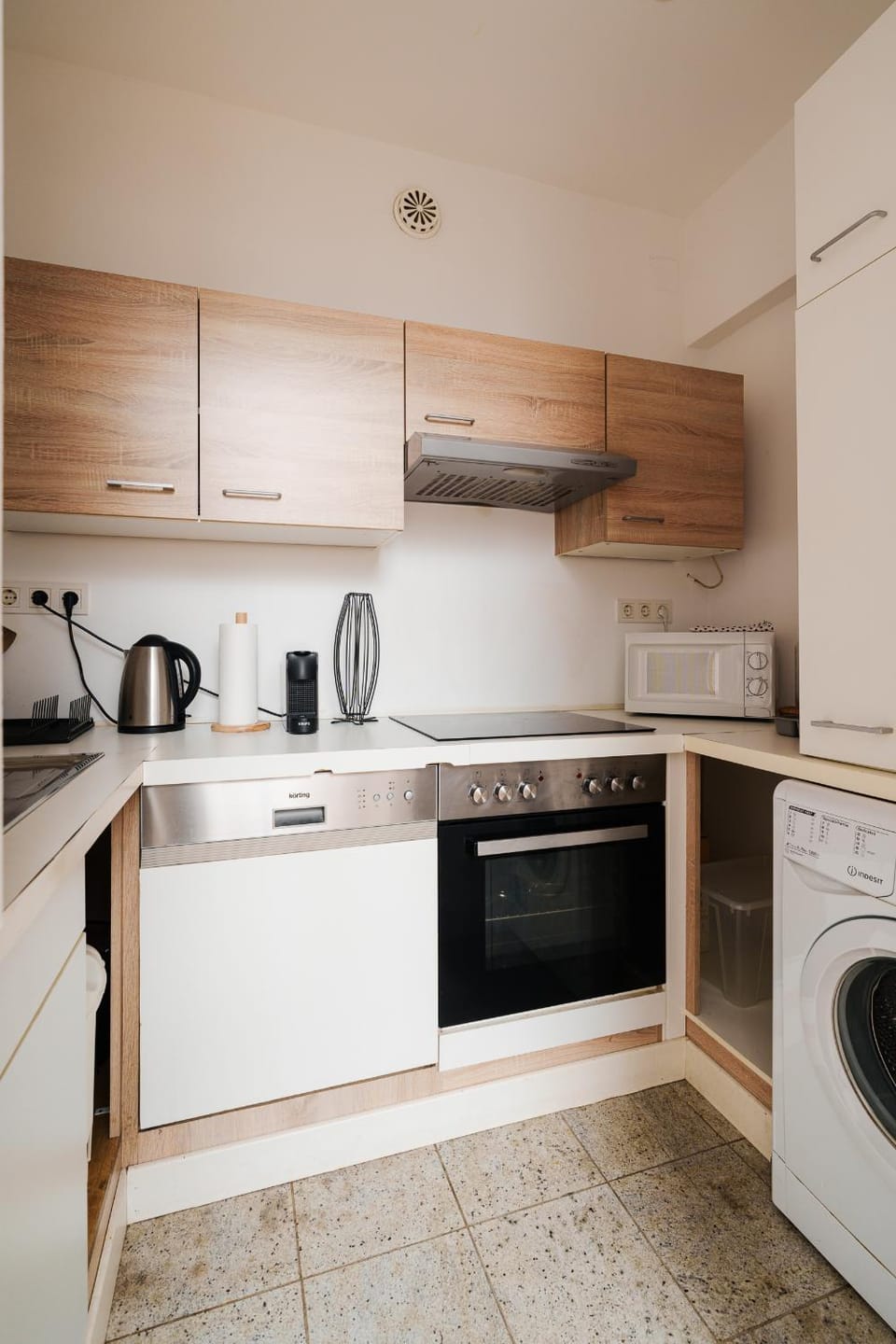 Kitchen or kitchenette, stove, washing machine