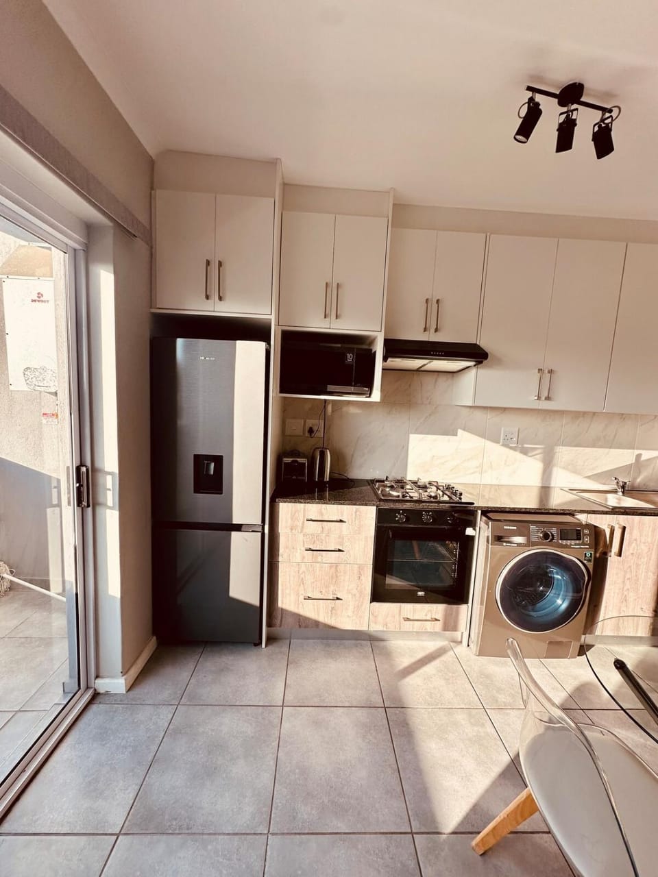 Kitchen or kitchenette, oven, stove, toaster, washing machine, dryer