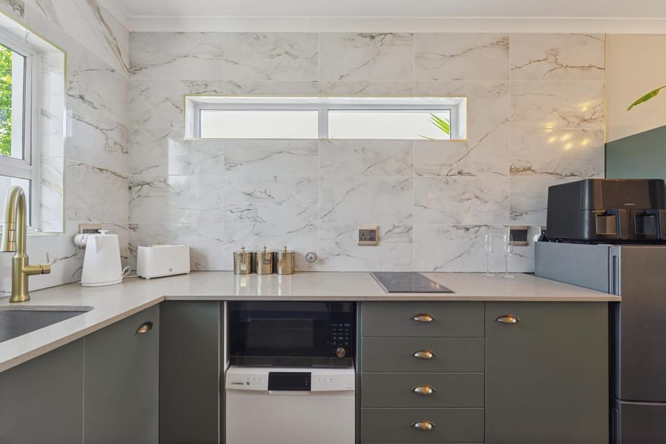 Kitchen or kitchenette, dishwasher, microwave, stove, toaster