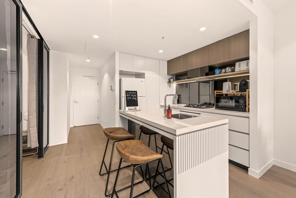 Kitchen or kitchenette, dishwasher, oven, stove