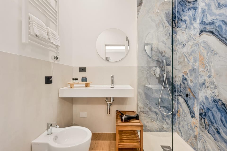 Shower, Toilet, Bathroom, hair dryier, towels