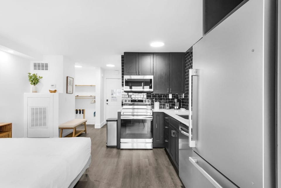 Kitchen or kitchenette, dishwasher, oven, stove