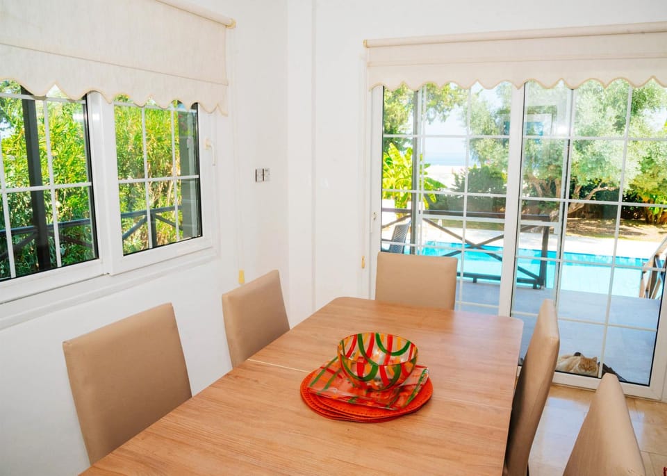 View (from property/room), Living room, Seating area, Dining area, Swimming pool