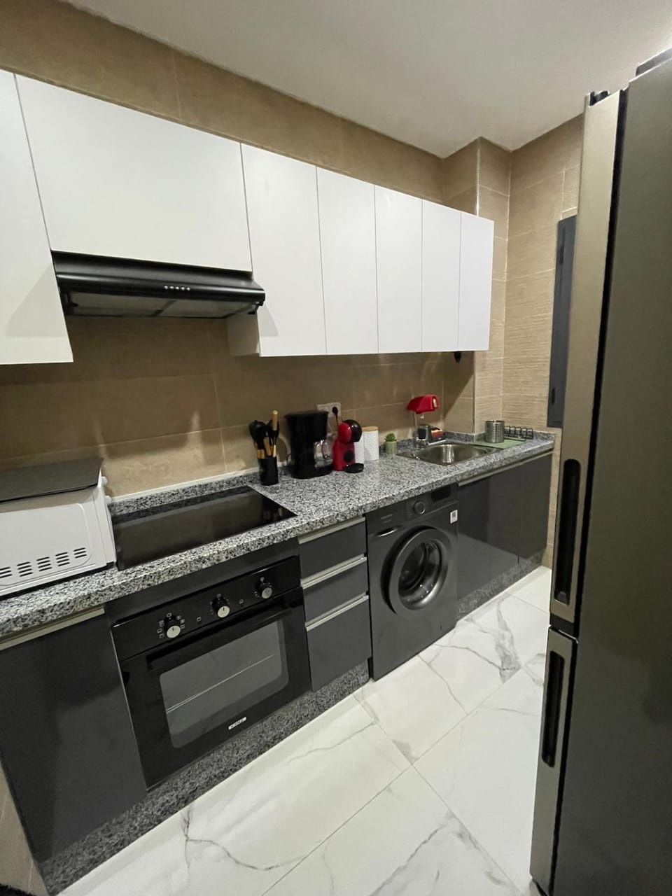 Kitchen or kitchenette, oven, stove, washing machine