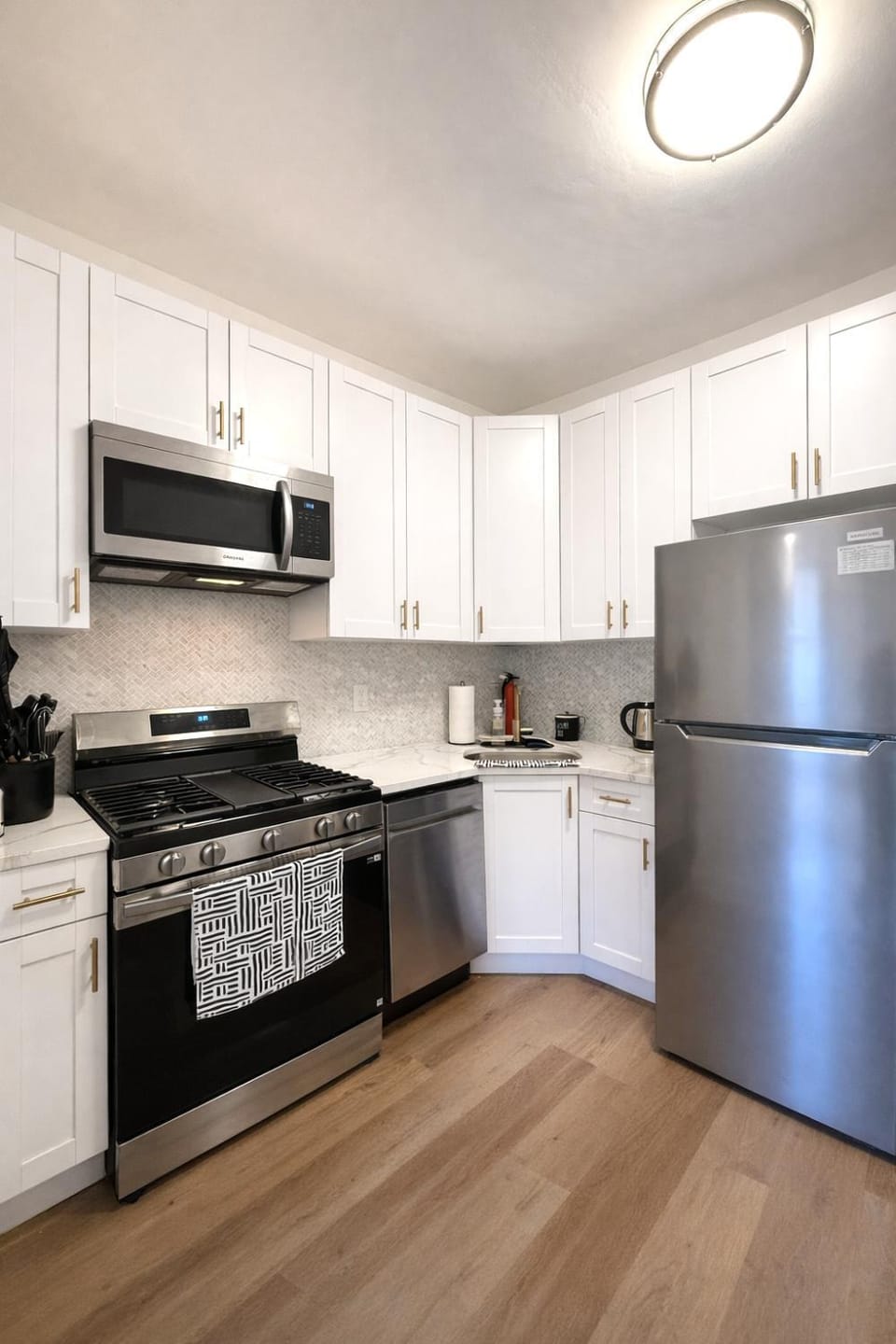 Kitchen or kitchenette, dishwasher, oven, stove, toaster