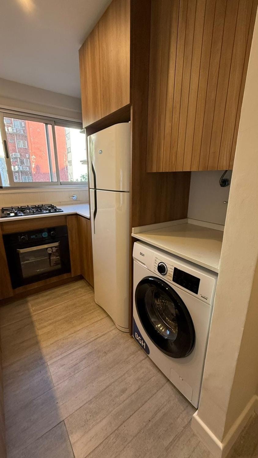 Kitchen or kitchenette, stove, washing machine
