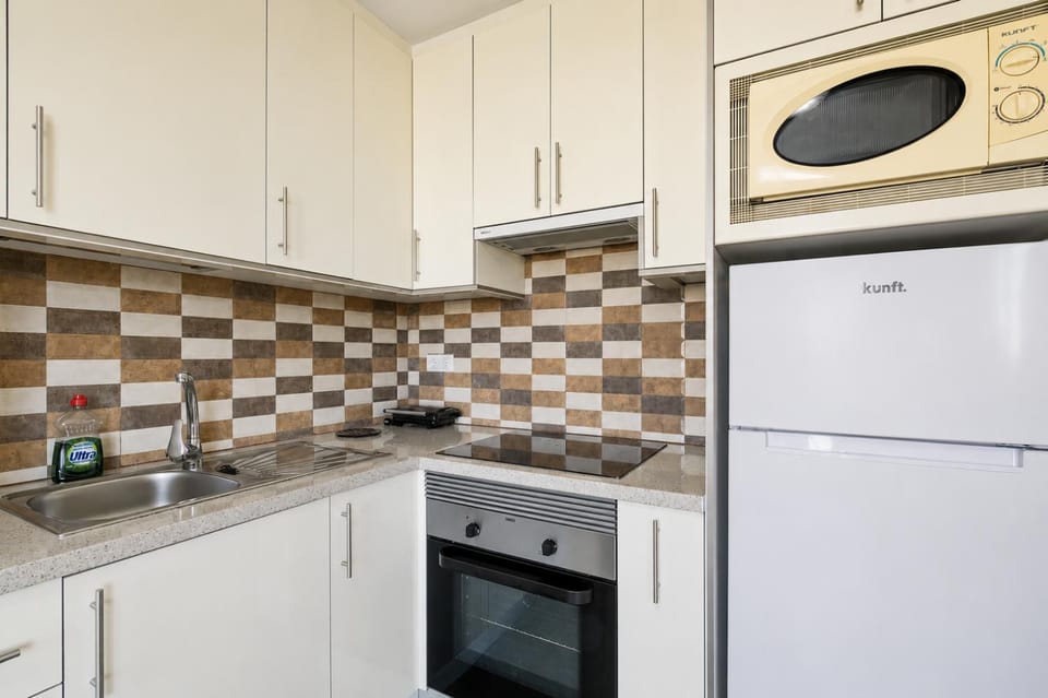 Kitchen or kitchenette, oven, stove