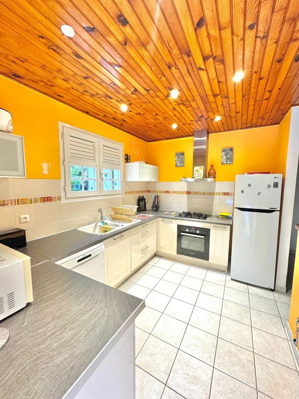Kitchen or kitchenette, dishwasher, oven, stove, toaster