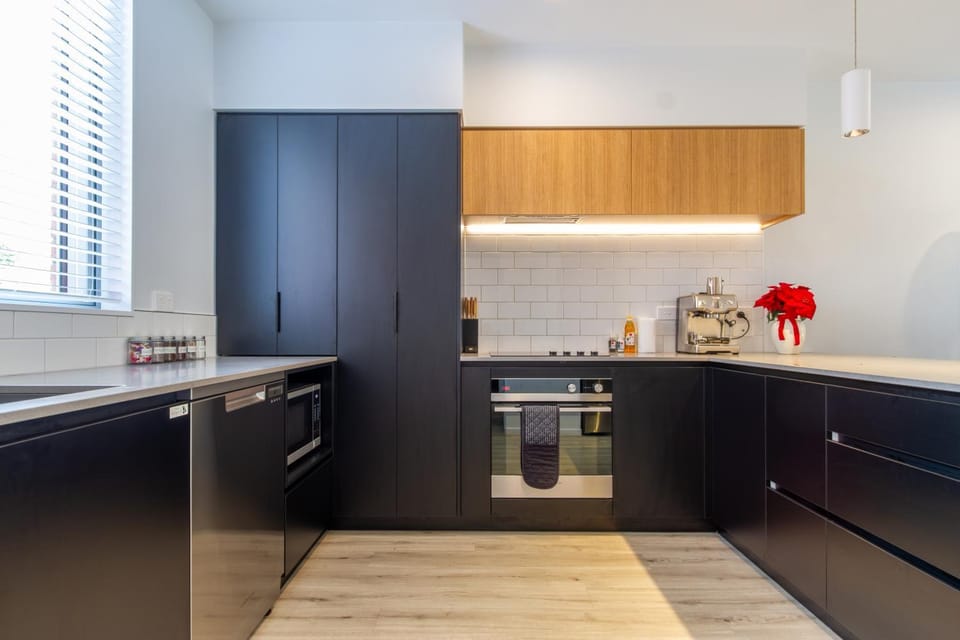Kitchen or kitchenette, dishwasher, oven, stove