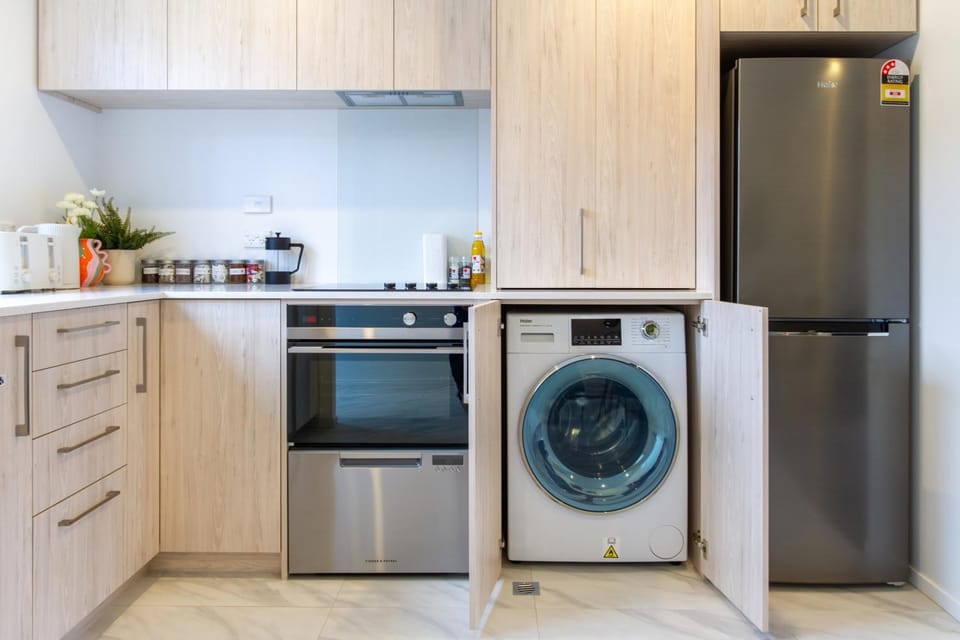 Kitchen or kitchenette, dishwasher, oven, stove, washing machine