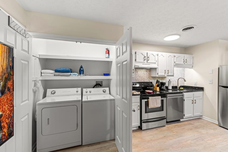 Kitchen or kitchenette, dishwasher, oven, stove, washing machine, washing machine, dryer