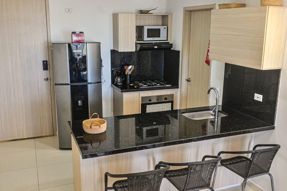 Kitchen or kitchenette, microwave, oven, stove