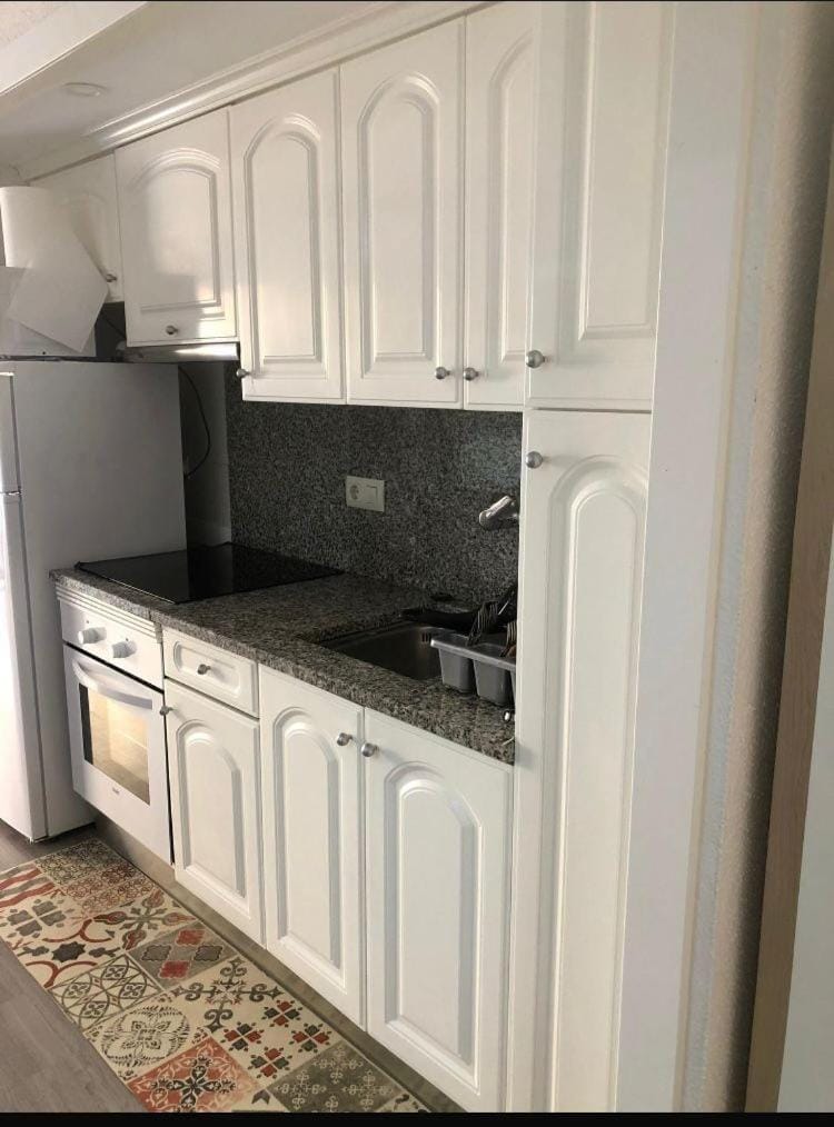 Kitchen or kitchenette, oven