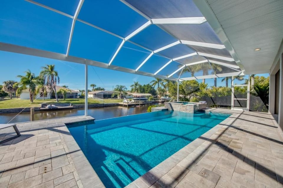 CoralVilla Pure Elegance - prime boat location, pool, hot tub, outdoor kitchen House in Cape Coral
