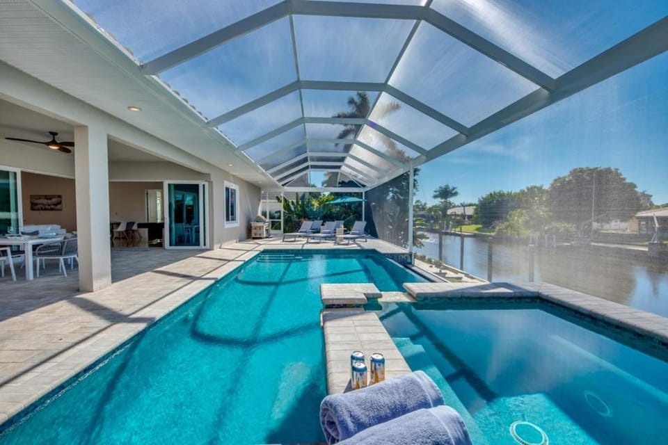 CoralVilla Pure Elegance - prime boat location, pool, hot tub, outdoor kitchen House in Cape Coral