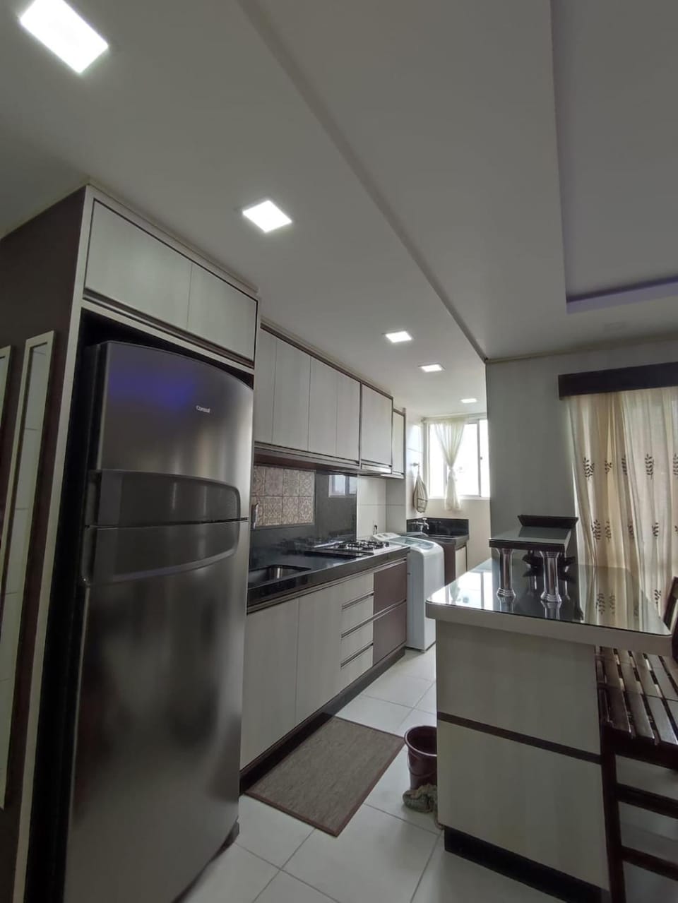Kitchen or kitchenette, dishwasher, oven, stove