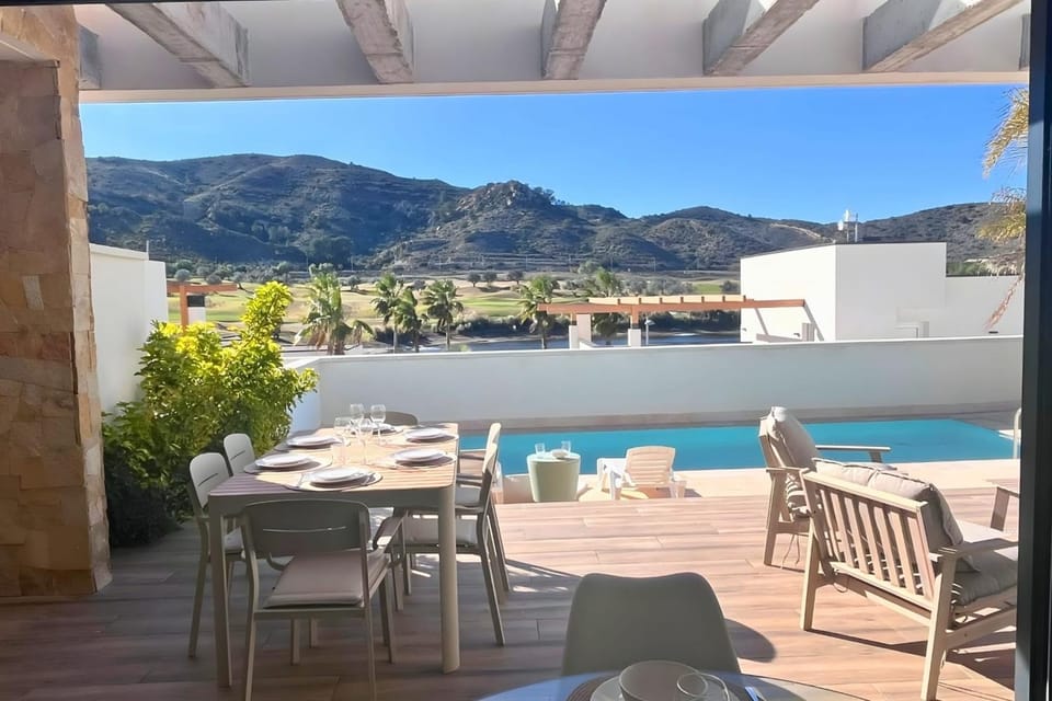 Property building, Patio, Natural landscape, Balcony/Terrace, Dining area, Mountain view, Pool view, Swimming pool, sunbed