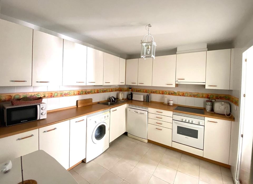 Kitchen or kitchenette, dishwasher, flat iron, stove, washing machine, kitchen