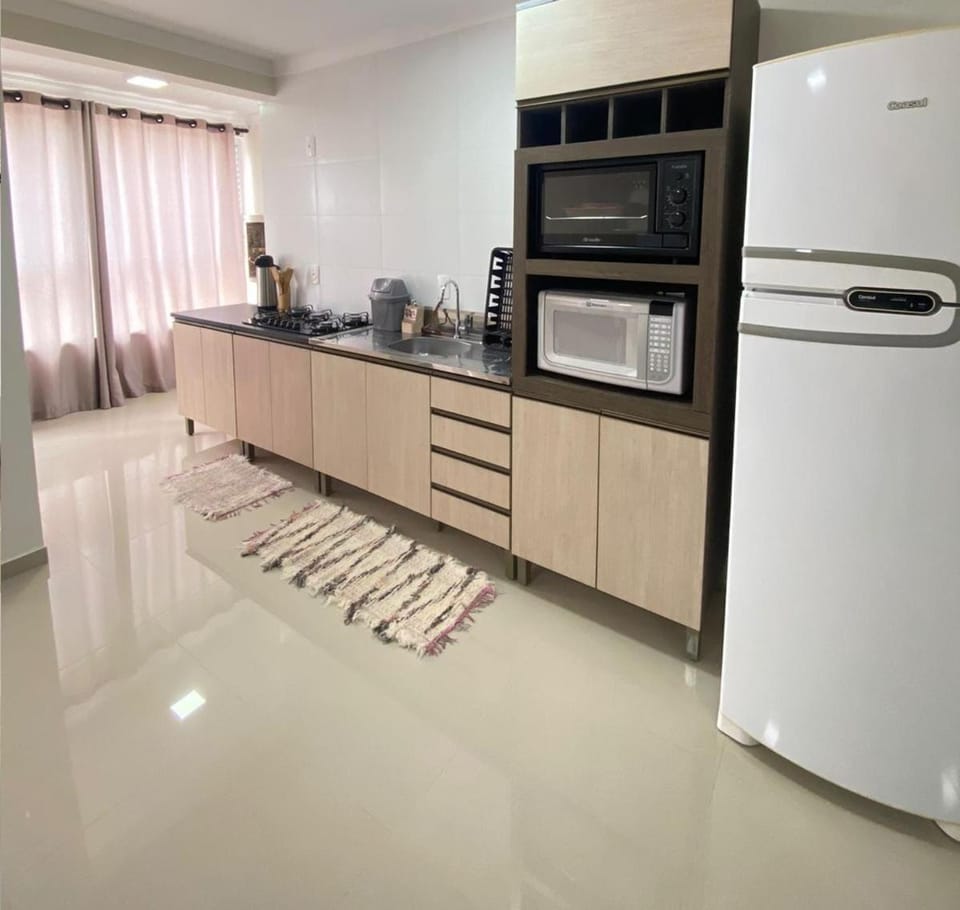 Kitchen or kitchenette, dishwasher, microwave, oven, stove