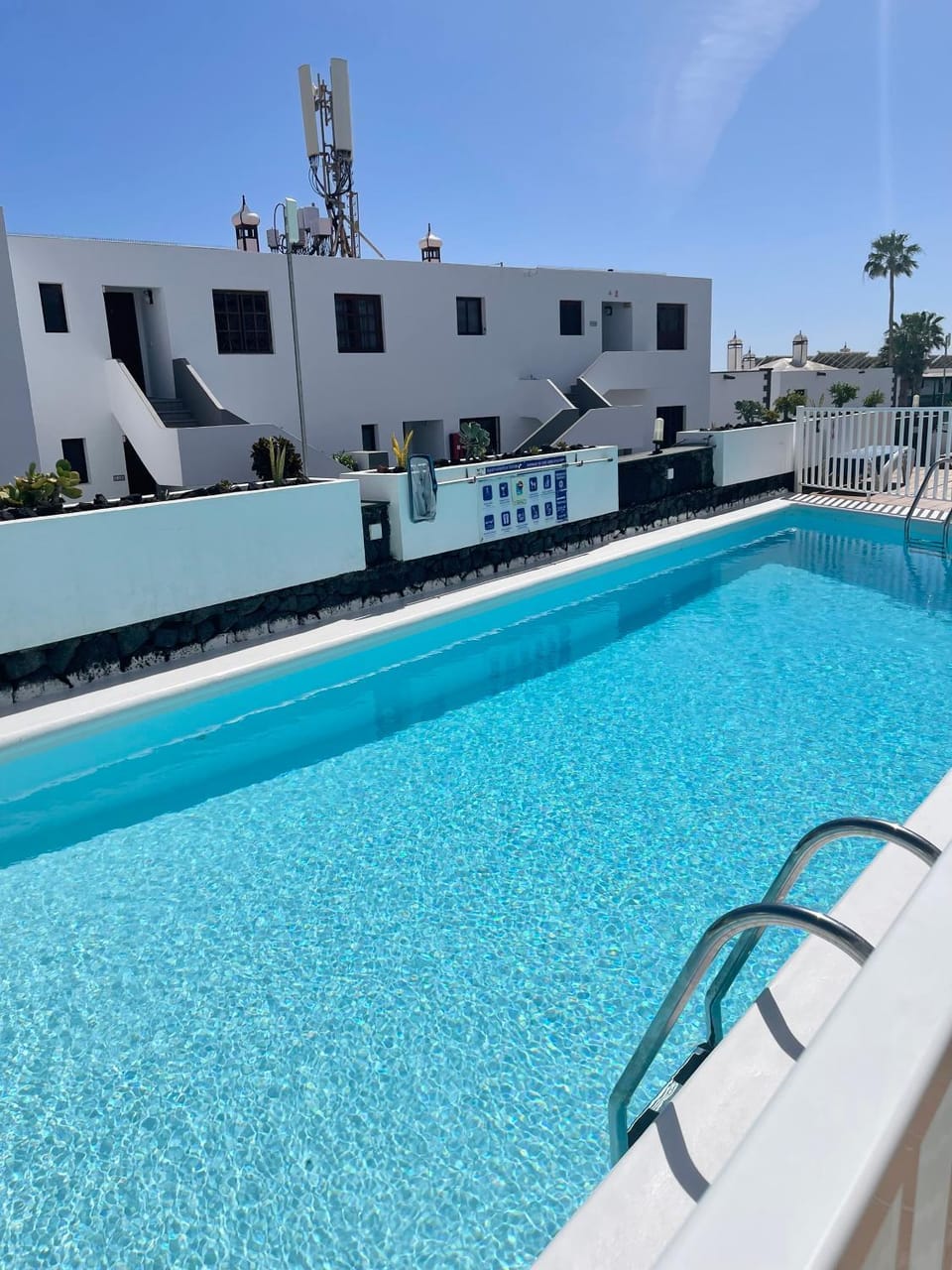 Property building, Day, Pool view, sunbed