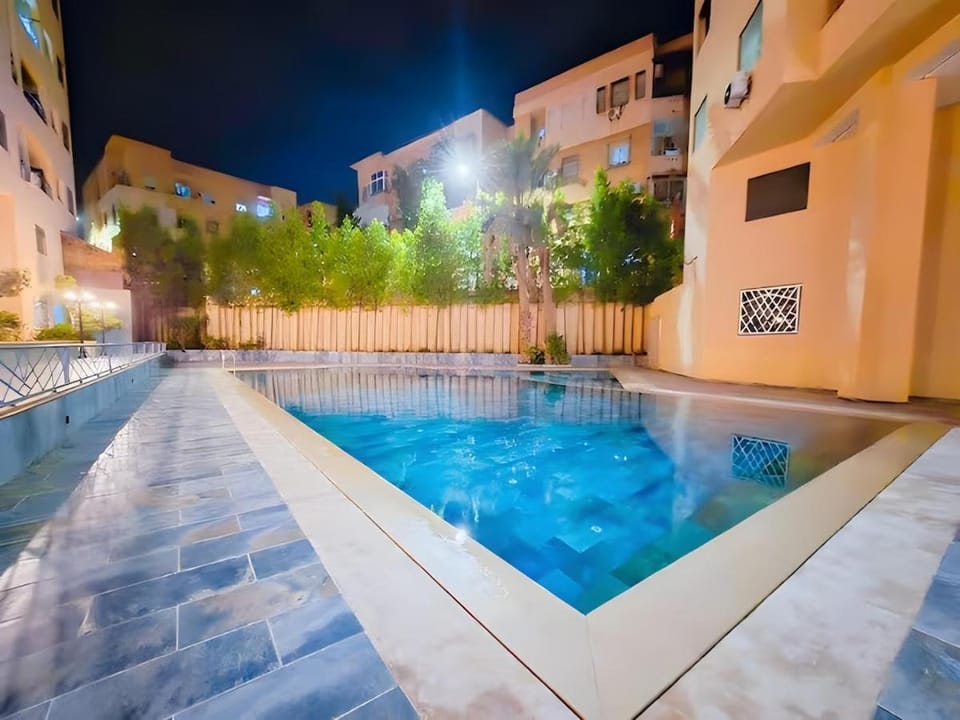 Property building, Night, Pool view, Swimming pool
