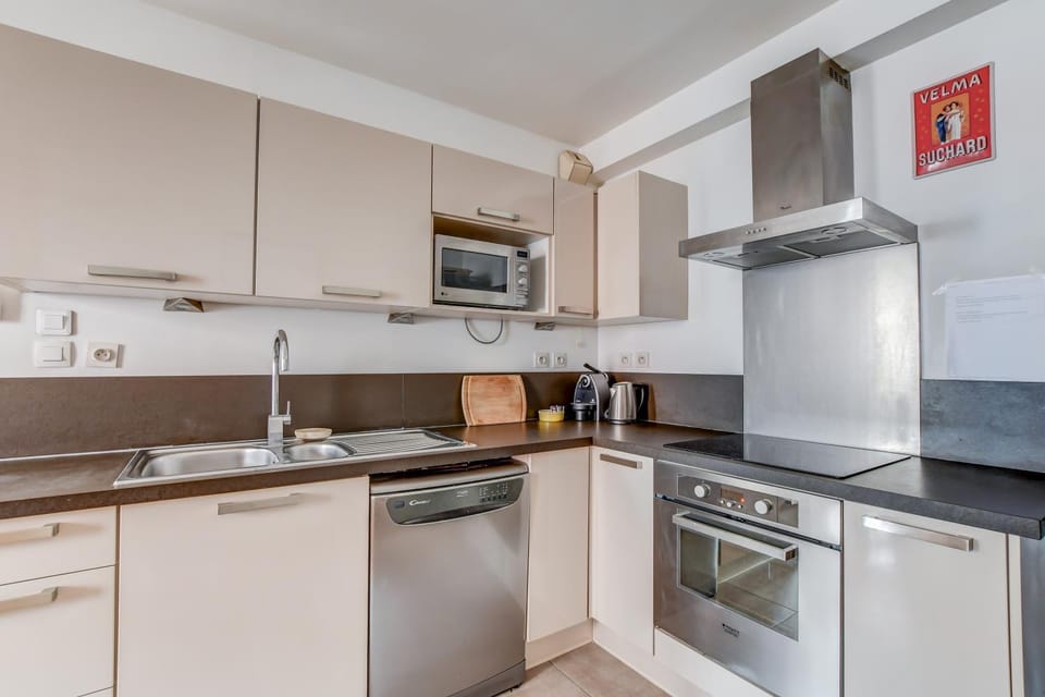 Kitchen or kitchenette, dishwasher, oven, stove, toaster