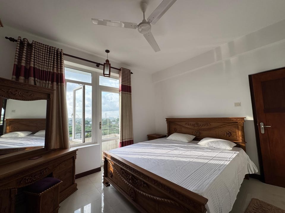 Bed, Balcony/Terrace, Bedroom, City view, Lake view, flat iron, hair dryier, wardrobe, air conditioner
