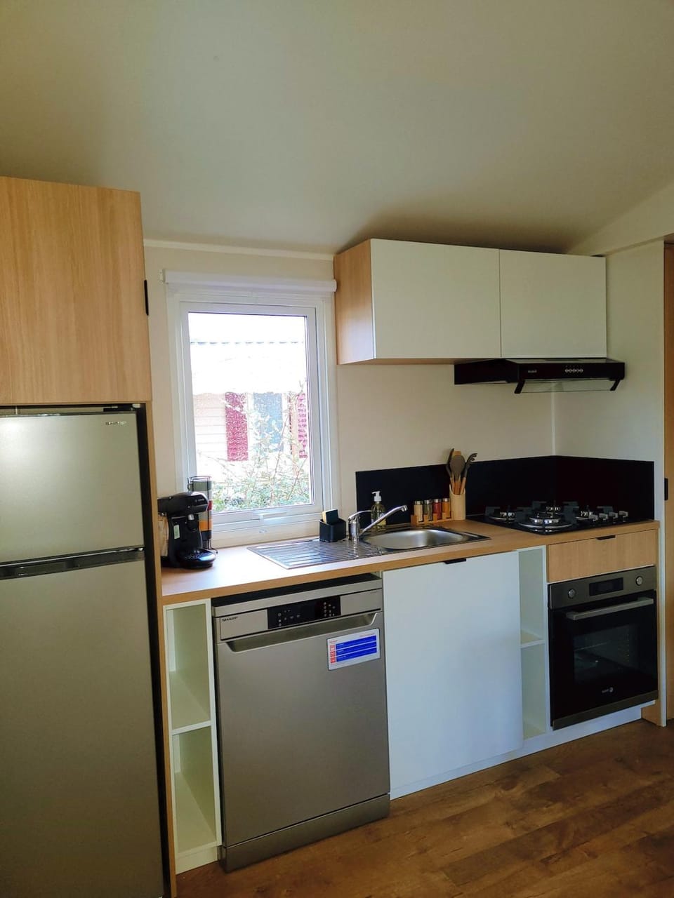 Kitchen or kitchenette, dishwasher, oven, stove