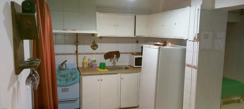 Kitchen or kitchenette, microwave, oven, air conditioner