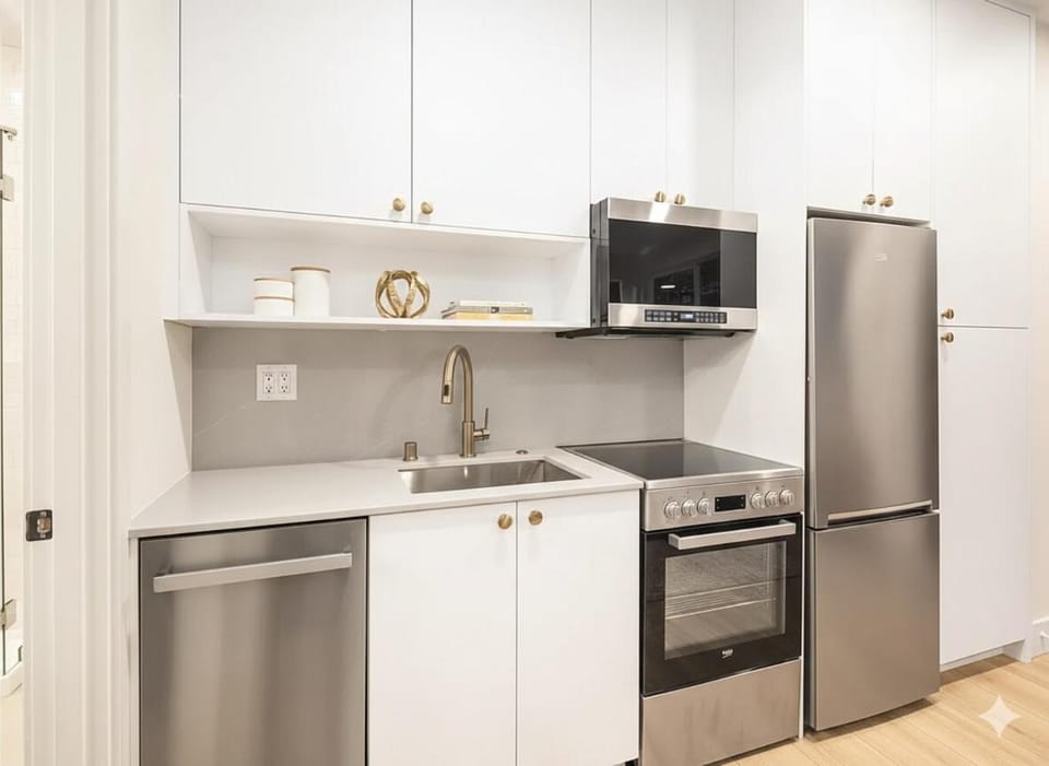 Kitchen or kitchenette, dishwasher, oven, stove