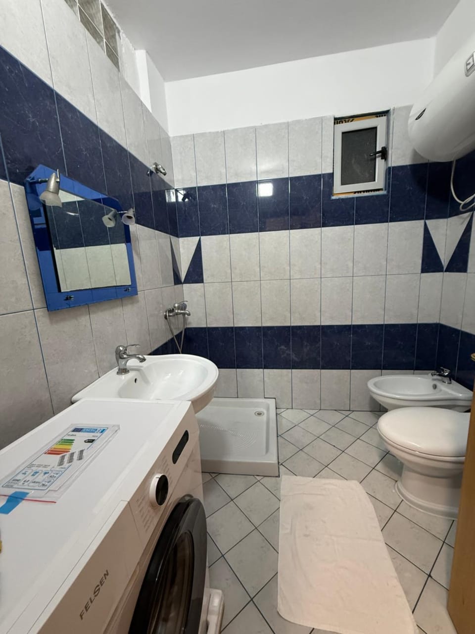 Shower, Toilet, bidet, towels, washing machine, dryer