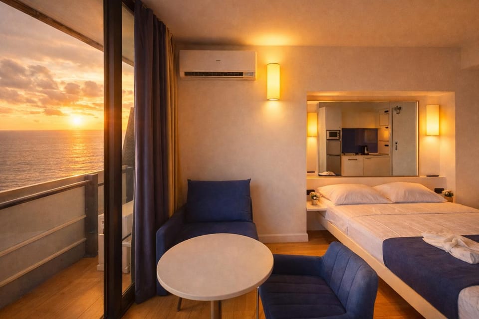 Communal lounge/ TV room, Bed, Natural landscape, TV and multimedia, Living room, Photo of the whole room, Seating area, Evening entertainment, Bedroom, Sea view, towels, air conditioner