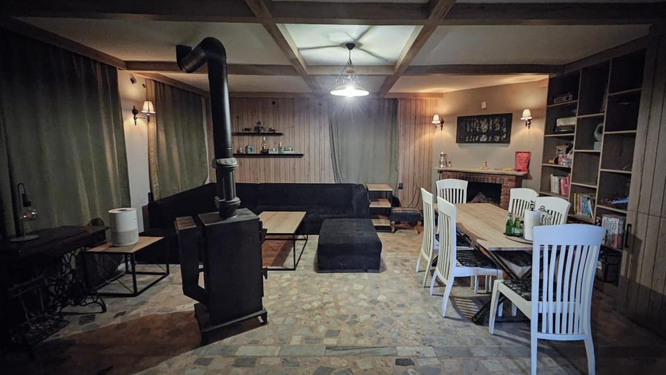 Library, Living room, Seating area, Dining area, fireplace, stove