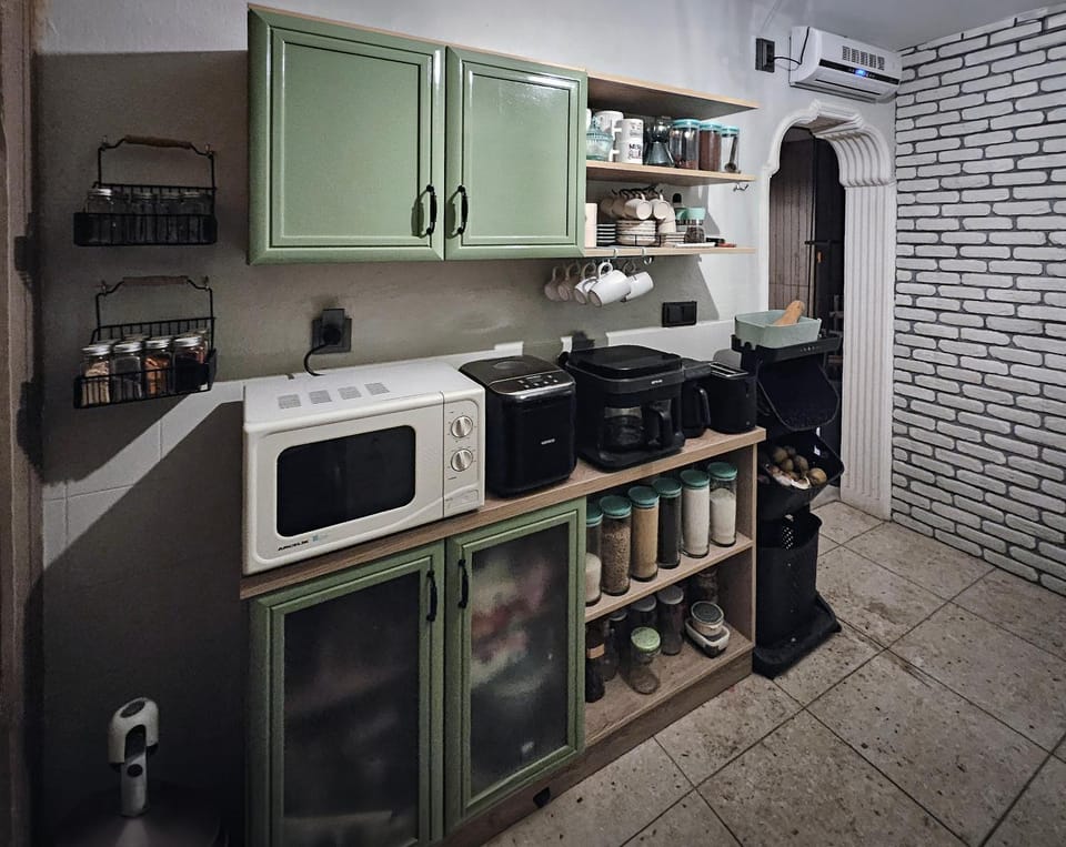 Kitchen or kitchenette, dishwasher, microwave, oven, toaster