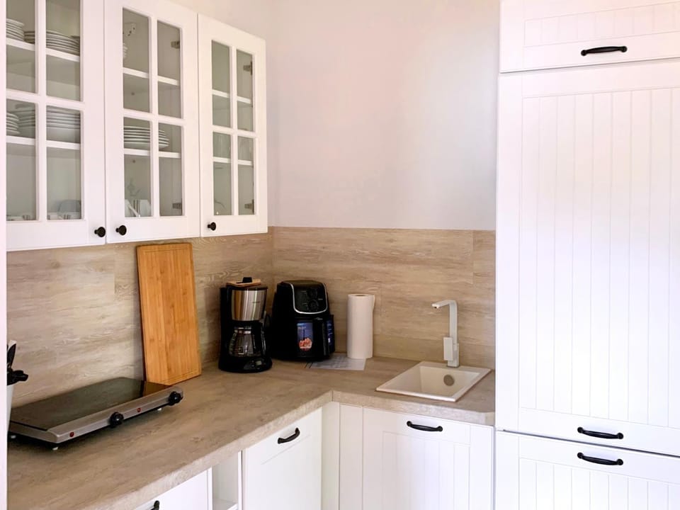 Photo of the whole room, stove, toaster, kitchen