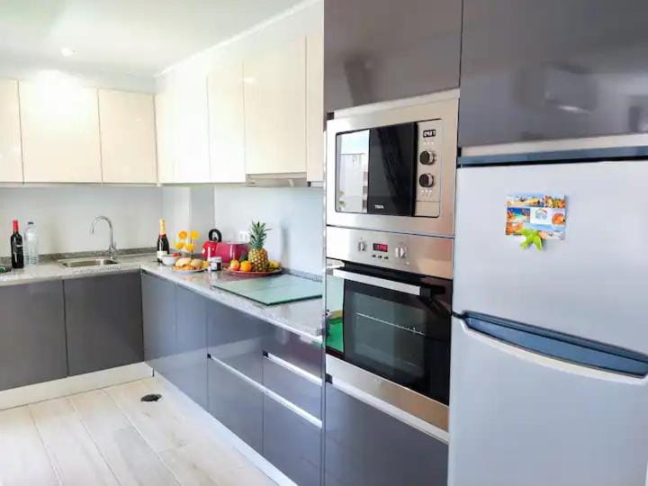 Kitchen or kitchenette, dishwasher, oven, stove, toaster
