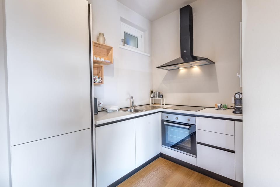 Kitchen or kitchenette, dishwasher, oven, stove