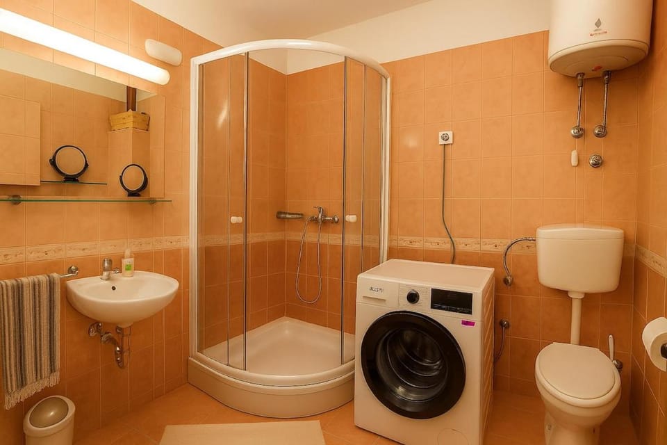Shower, Toilet, Bathroom, towels, washing machine, dryer
