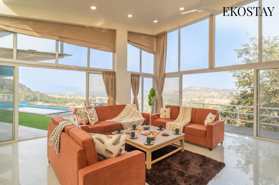 Day, Natural landscape, Living room, Seating area, Mountain view, Pool view, Swimming pool
