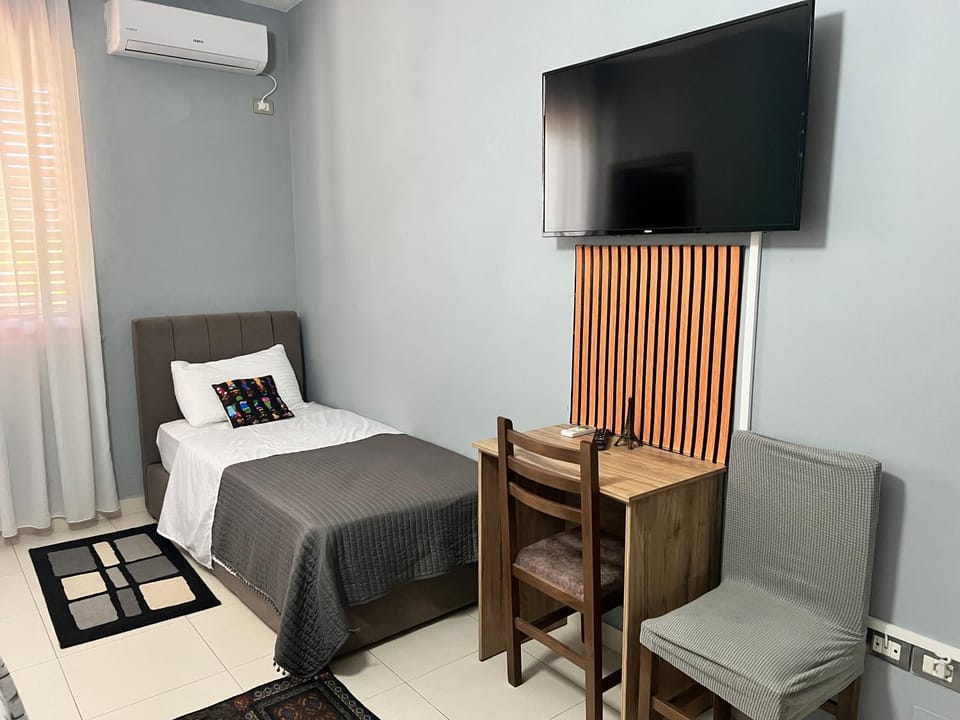Communal lounge/ TV room, Bed, TV and multimedia, Photo of the whole room, Seating area, Evening entertainment, Bedroom, hair dresser, air conditioner