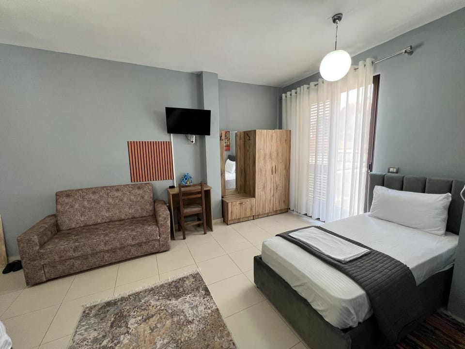 Communal lounge/ TV room, Bed, TV and multimedia, Living room, Photo of the whole room, Seating area, Evening entertainment, Bedroom, hair dresser, wardrobe